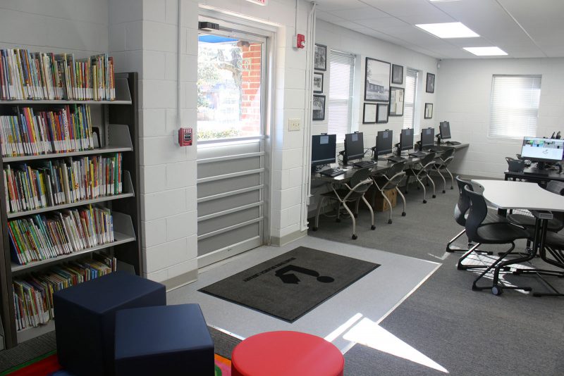 Bragtown's main entrance with new widened doorway, children's books to the left. and computer area to the right