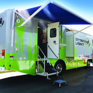 The Tech Mobile: a large vehicle with open doors and extended canopies