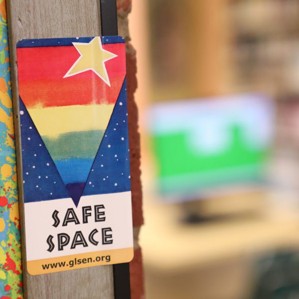 Colorful sign saying "Safe Space" posted in a door frame
