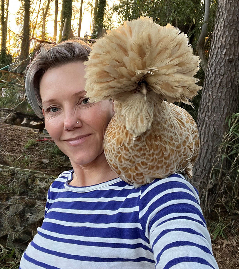 Jana with a dramatically coiffed buff laced Polish chicken named Agnes perched on her shoulder.