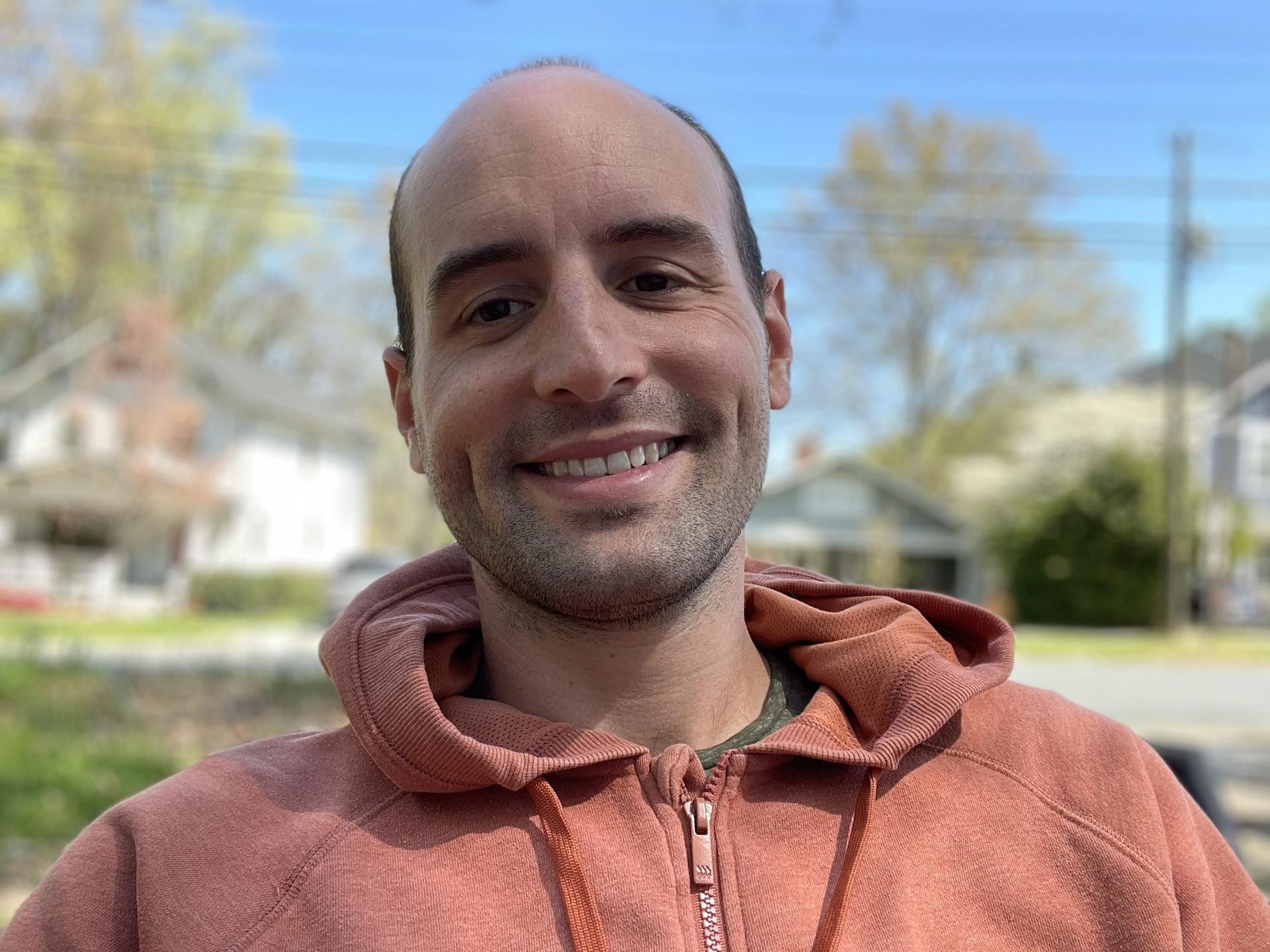 Matías Murano wearing an orange hoodie