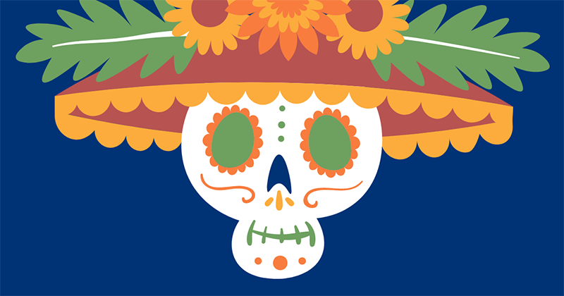 Mexican sugar skull wearing a festive hat.