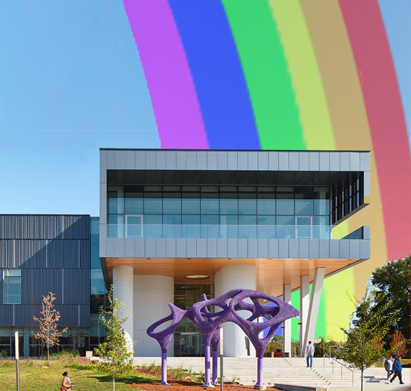 Front of Main Library with a giant cartoon rainbow in the background.