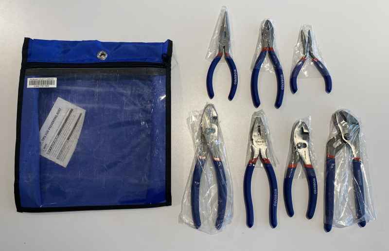 7 pairs of pliers of various types and sizes. The empty blue zippered bag sits next to the kit.