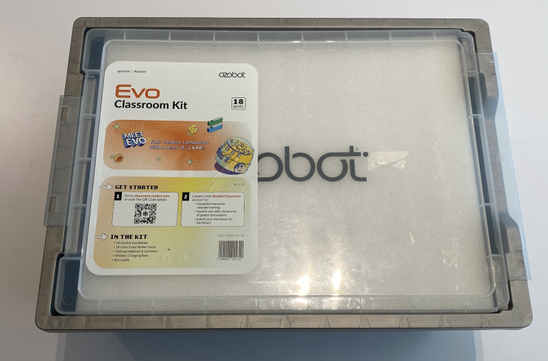 Top of a closed plastic bin with a sticker on top saying "Evo classroom kit," a list of kit contents, and a QR code to get started.