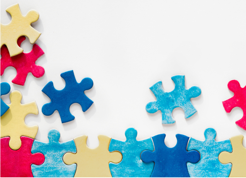 Jigsaw puzzle pieces, some connected and some loose.