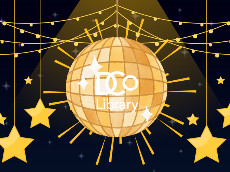 A shining disco ball with the DCo Library logo on the side, surrounded by fairy lights and hanging star decorations.