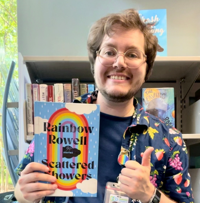 Ezra holding up the book 